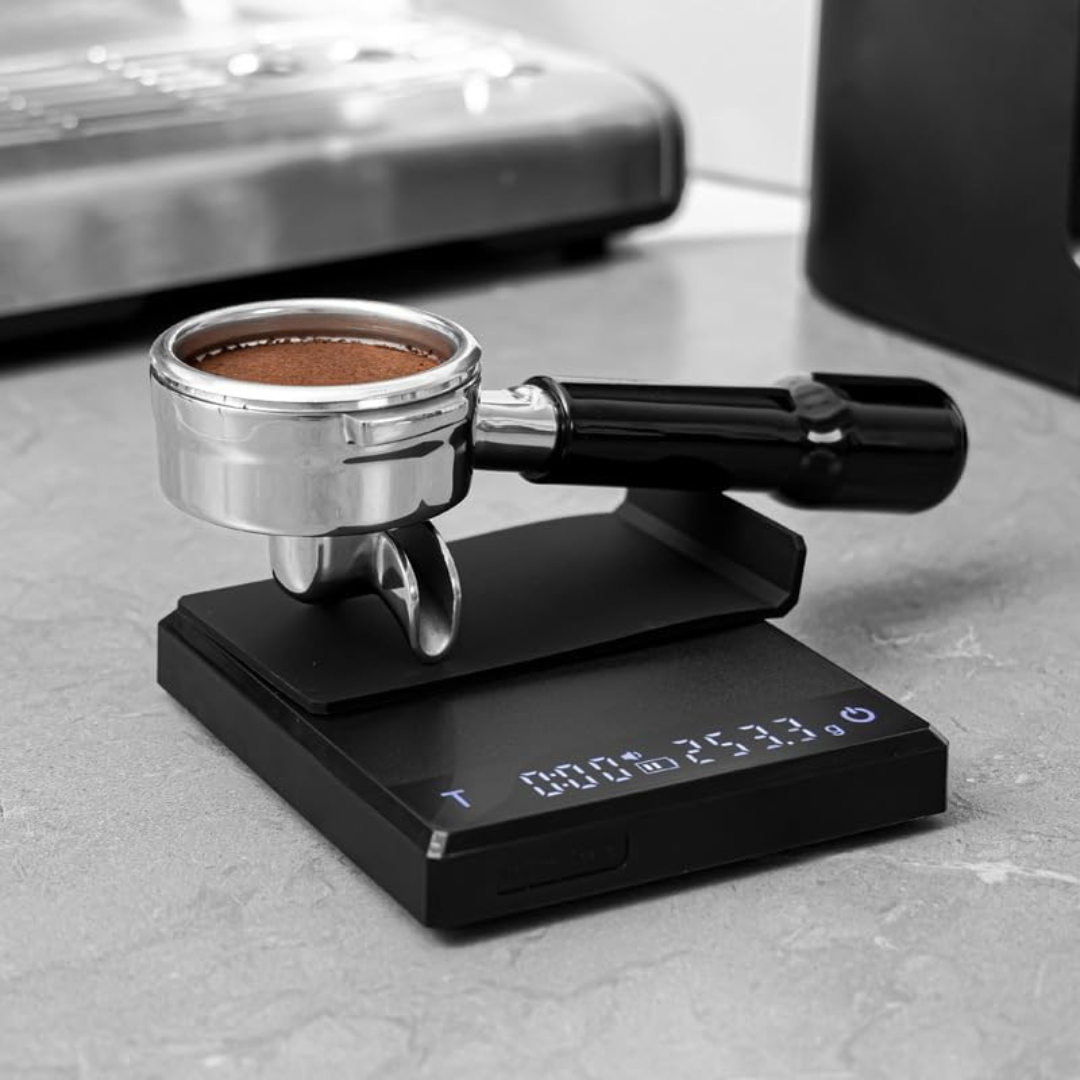 0.1g High Precision Drip Espresso Scale with portafilter on top, measuring coffee grounds for precise espresso brewing.

